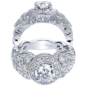 Taryn TE5451W44JJ 14 karat white gold engagement ring, front and profile views of a round center in a halo between domed pave clusters with bezel accents