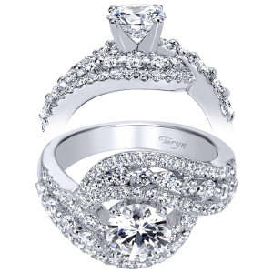 Taryn TE5498W44JJ 14 karat white gold engagement ring, angled and profile views of a round center swept by a spiral of larger rounds and pave