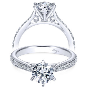 Taryn TE6687W44JJ 14 karat white gold engagement ring, front view of a six prong head above filigree scrolls and a milgrain edged pave row
