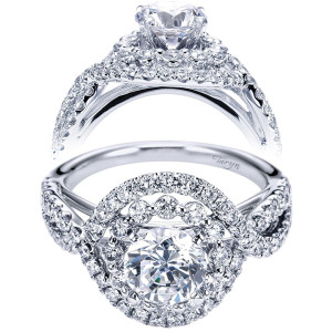 Taryn TE6964W44JJ 14 karat white gold engagement ring, front and profile views of a round center in a double halo above twisting pave rails