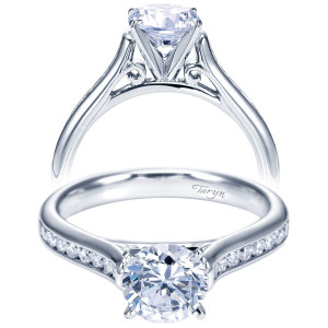 Taryn TE7443W44JJ 14 karat white gold engagement ring, front view of a round center above a channel set shank with scrolled filigree gallery