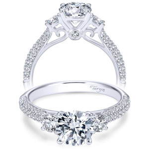 Taryn TE7465W44JJ 14 karat white gold engagement ring, front view of three round stones above double row pave shoulders with a bezel accented scroll gallery
