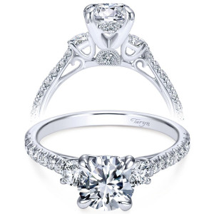 Taryn TE7477W44JJ 14 karat white gold engagement ring, front view of a round center with side stones over a hidden halo and pave shank