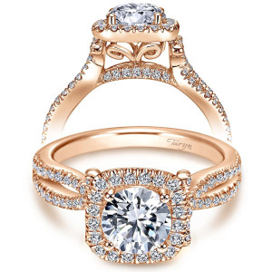 Taryn TE7806K44JJ 14 karat rose gold engagement ring, front view of a round center in a cushion shaped halo, scroll gallery over crossing pave rails