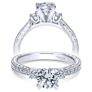 Taryn TE8009W44JJ 14 karat white gold engagement ring, front view of a round center flanked by two round sides above engraved wheat patterned shoulders