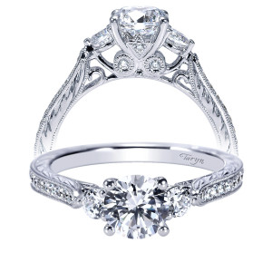 Taryn TE8800W44JJ 14 karat white gold engagement ring, front and profile views of a round center between single side stones on milgrain edged pave shoulders