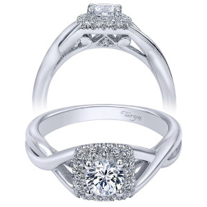 Taryn TE910154W44JJ 14 karat white gold engagement ring, angled and profile views of a cushion halo on a polished knotted crossover shank with open gallery