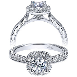 Taryn TE911875R2W44JJ 14 karat white gold engagement ring, front view of a round center ringed by larger shared prong stones above an engraved milgrain shank