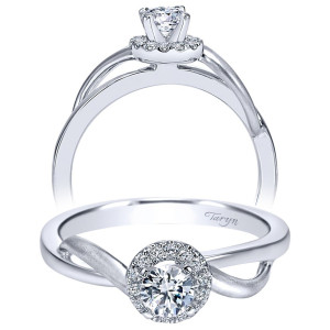 Taryn TE97719W44JJ 14 karat white gold engagement ring, angled view of a round center in a compact halo between plain crossing rails, one brushed