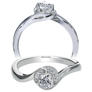 Taryn TE97772W44JJ 14 karat white gold engagement ring, angled view of a round center in a milgrain edged swirl halo on a polished bypass shank