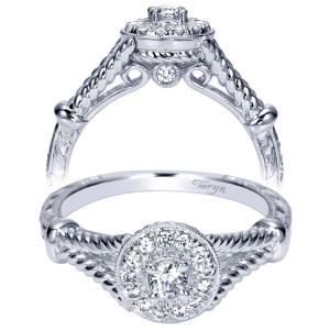 Taryn TE98436W44JJ 14 karat white gold engagement ring, angled view of a round center in a halo framed by rope rails and engraved shoulders