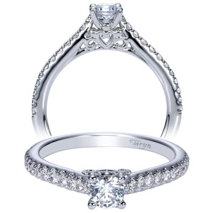 Taryn TE98574W44JJ 14 karat white gold engagement ring, front view of a round center with an open heart beneath the head and pave shoulders
