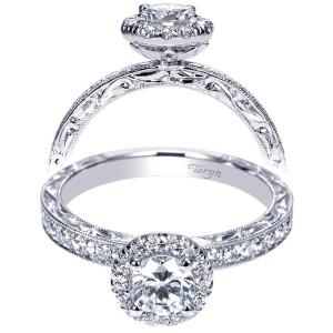 Taryn TE99012W44JJ 14 karat white gold engagement ring, front view of a round center in a halo with bead set shoulders and engraved scroll sides
