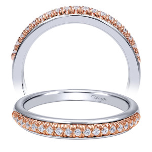 Taryn TW10765T44JJ 14 karat white and rose gold wedding band, front view of a single prong set row of rounds along one edge of a polished domed face