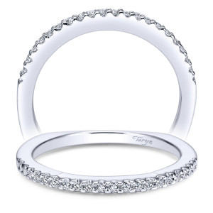 Taryn TW4115W44JJ 14 karat white gold wedding band, angled view of fine shared prong rounds along a slim rounded curve with a plain back