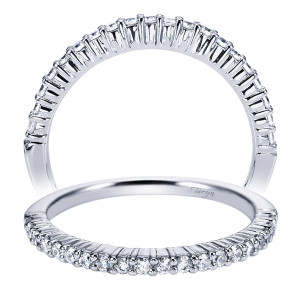 Taryn TW4233W44JJ 14 karat white gold wedding band, two views of a slender row of small rounds in shared prongs stopping before the base