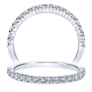 Taryn TW8276W44JJ 14 karat white gold wedding band, front view of larger shared prong stones across a wider rim, polished lower shoulders