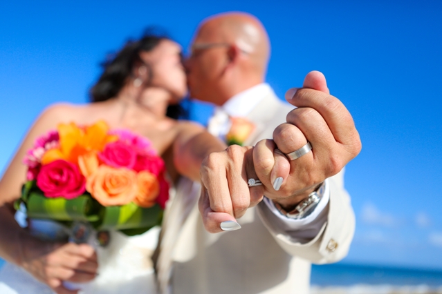 Cara and Greg show off their rings while honeymooning in Cancun Mexico