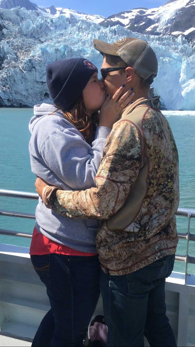 Paige and Brendan surprise proposal kissing glacial tour Alaska Verragio