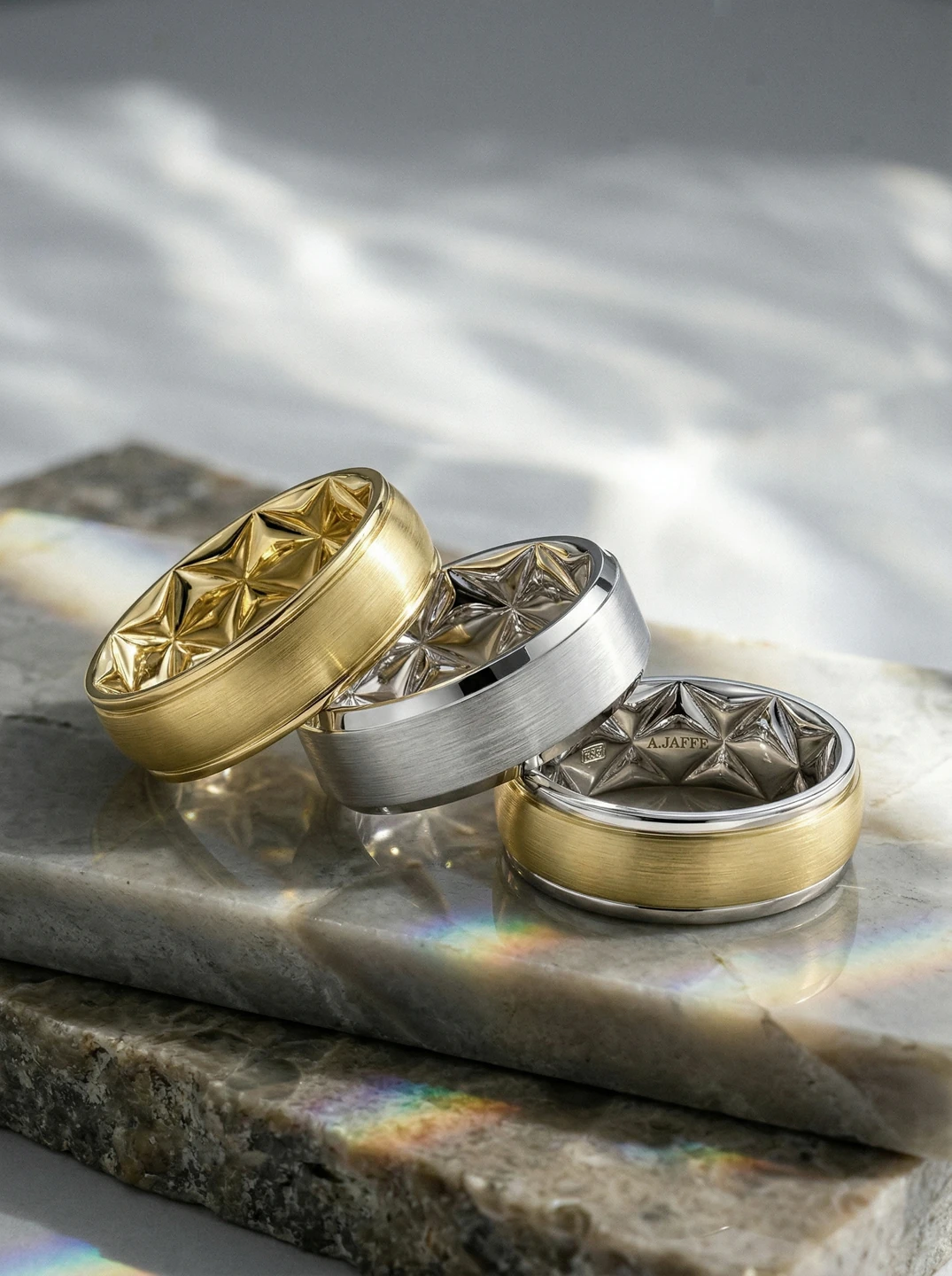 A.JAFFE wedding bands in yellow and white metal with quilt-patterned interiors