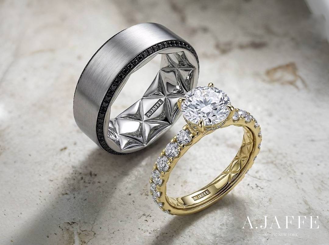A.JAFFE MECRD2775Q diamond engagement ring beside a GR3487QGE black-diamond band, showing their Quilts interiors