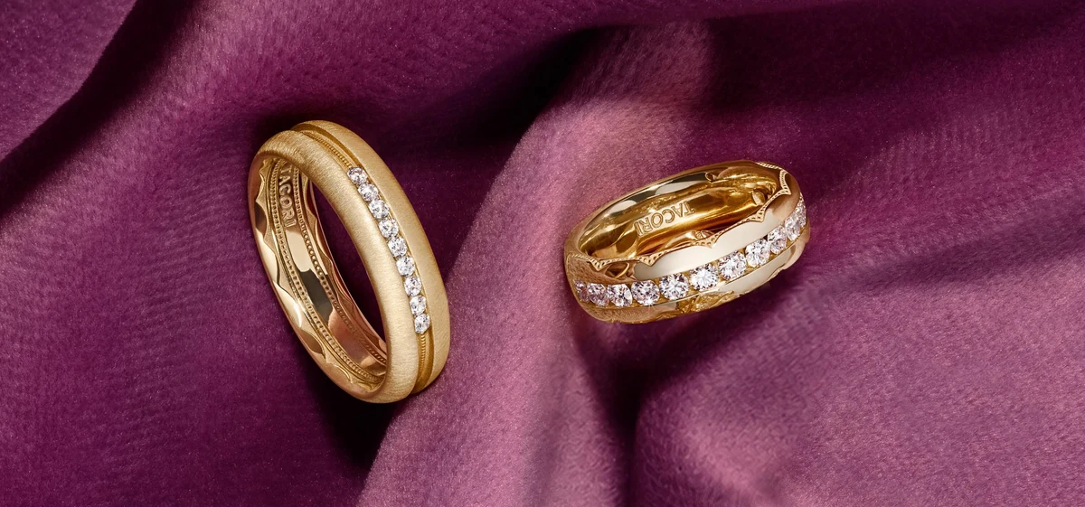 Tacori yellow-gold Channel-Set Diamond Band 4716B12Y and Rounded Satin Finish Diamond Wedding Band 1686YDS on plum fabric