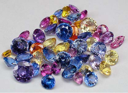 A scatter of sapphires in blue, pink, purple and yellow